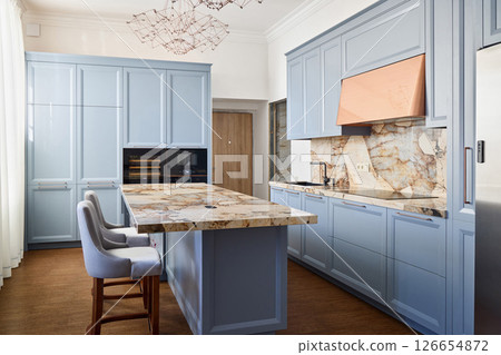 An Elegant Blue Kitchen Design featuring Beautiful Marble Countertops and Stylish Interiors 126654872