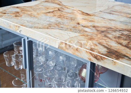 An Elegant Marble Countertop featuring a stunning Glassware Display for Your Home and Bar An Elegant Marble Countertop featuring a stunning Glassware Display for Your Home and Bar 126654932