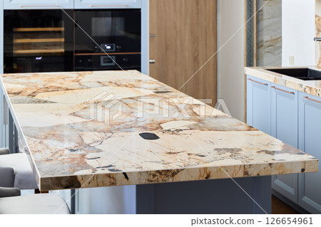 An Elegant and Stylish Kitchen Featuring a Luxurious Stone Countertop That Stands Out An Elegant and Stylish Kitchen Featuring a Luxurious Stone Countertop That Stands Out 126654961