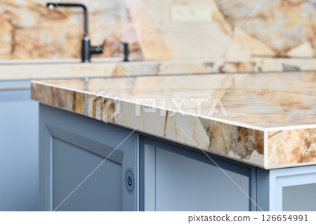 An Elegant Kitchen Counter Featuring a Stylish and Sophisticated Marble Design Element 126654991