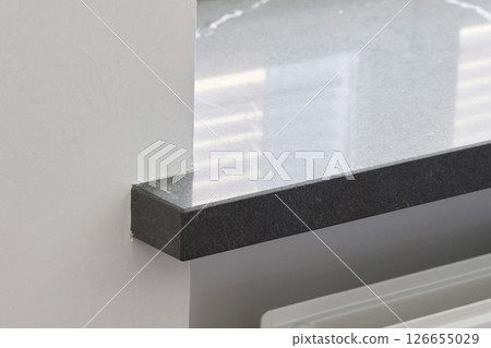 A Modern Kitchen Countertop that Features Sleek Edges for an Elegant Look and Feel A Modern Kitchen Countertop that Features Sleek Edges for an Elegant Look and Feel 126655029