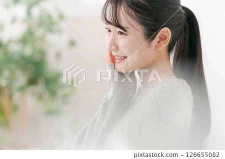 Profile of a woman doing skin care 126655082