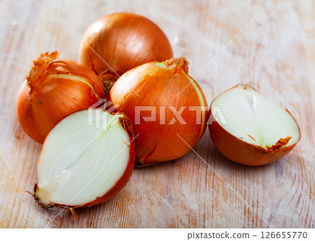 Fresh halved and whole onions 126655770
