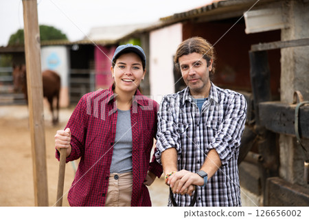 Farmers standing near barn 126656002
