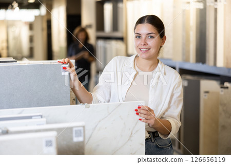 woman is considering MDF boards for internal insulation of residential premises 126656119