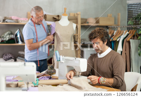 Tailors sew clothes in the workshop 126656124