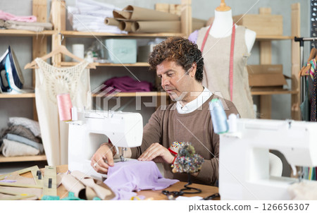 Man tailor at work 126656307