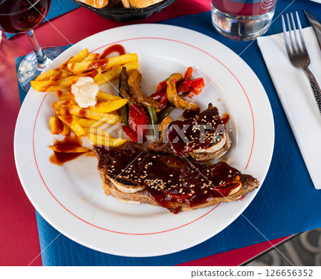 Grill dish Churasco of beef with barbecue sauce with vegetables 126656352