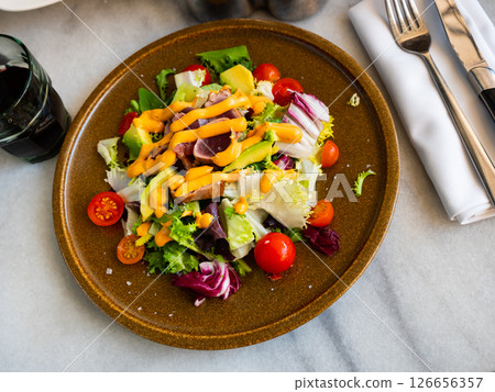 Tuna salad with vegetables and Anticucho sauce 126656357