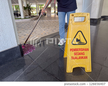 Cleaning in progress at a parking garage in Penang, Malaysia, showcasing maintenance efforts for public areas Cleaning in progress at a parking garage in Penang, Malaysia, showcasing maintenance efforts for public areas 126656407