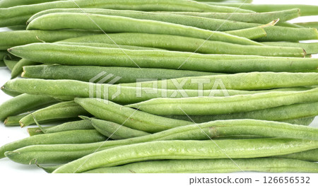 Fresh green beans creating a vibrant and healthy culinary background 126656532