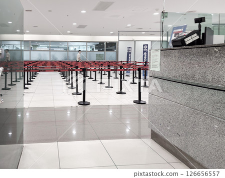 Passengers queue at airport security checkpoint in Penang International Airport, Malaysia 126656557