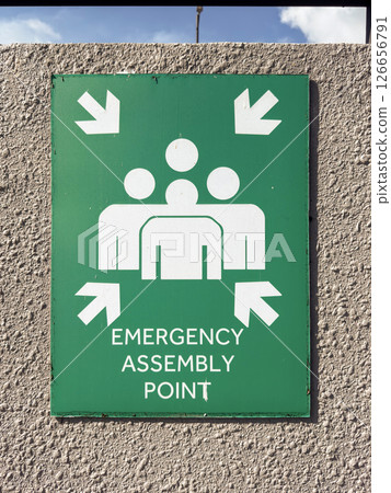 Emergency assembly point sign directs individuals to safe location in Penang, Malaysia 126656791
