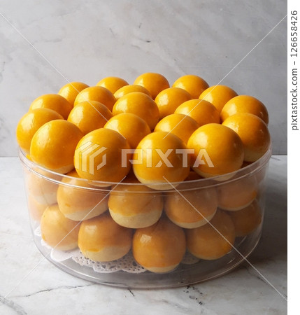 Pineapple cake, called Kue Nenas or Nastar in Indonesian, is one of the most popular traditional sweets to celebrate Eid al-Fitr. Indonesian people's favorite sweets. Selective focus. Pineapple cake, called Kue Nenas or Nastar in Indonesian, is one of the most popular traditional sweets to celebrate Eid al-Fitr. Indonesian people's favorite sweets. Selective focus. 126658426