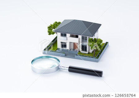 Residential model and magnifying glass 126658764