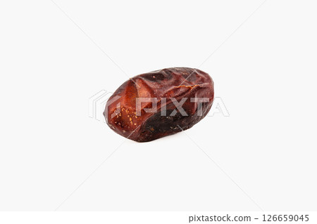 Dried date on a plain background showcases natural texture Dried date on a plain background showcases natural texture 126659045