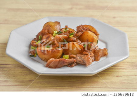 New potato and pork stir fry 126659618