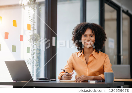 Asian woman feeling migraine head strain.Overworked businesswoman financier while working on laptop and tablet at office. Asian woman feeling migraine head strain.Overworked businesswoman financier while working on laptop and tablet at office. 126659678