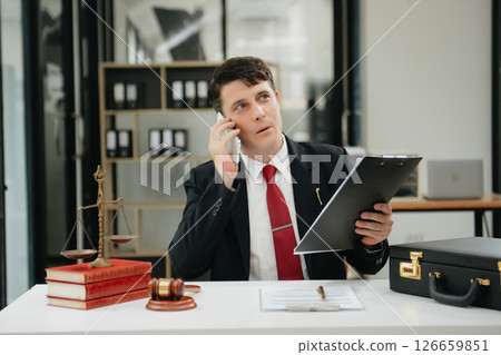 Man lawyer working and gavel, tablet, laptop in front, Advice justice and law concept. Man lawyer working and gavel, tablet, laptop in front, Advice justice and law concept. 126659851