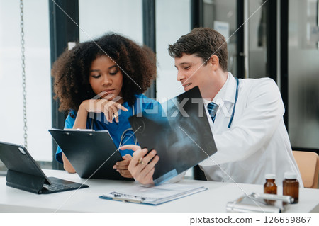 Medical technology network team meeting concept. Doctor hand working with smart phone modern digital tablet and laptop computer Medical technology network team meeting concept. Doctor hand working with smart phone modern digital tablet and laptop computer 126659867