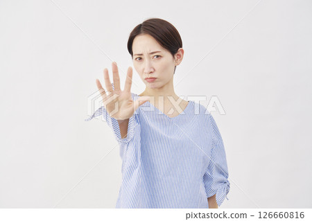 Woman, middle-aged, stopping gesture, white background Woman, middle-aged, stopping gesture, white background 126660816