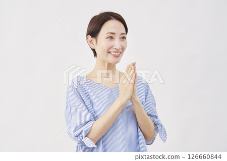 Woman, middle age, praying, hands together, white background, facing right Woman, middle age, praying, hands together, white background, facing right 126660844