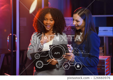 API Application Programming Interface, woman using laptop, tablet and smartphone with virtual screen API icon Software development tool, modern technology 126660976