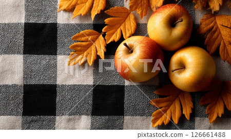 Red and Yellow Apples with Autumn Leaves on Plaid Fabric Red and Yellow Apples with Autumn Leaves on Plaid Fabric 126661488