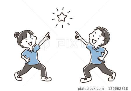 A man and woman in scrubs with their hands on their hips pointing at a star 126662818