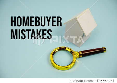 Homebuyer Mistakes text with White Model House and magnifying glass on blue background 126662971