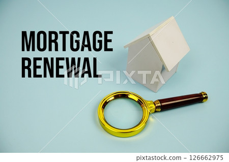 Mortgage Renewal text with White Model House and magnifying glass on blue background Mortgage Renewal text with White Model House and magnifying glass on blue background 126662975