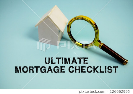 Ultimate Mortgage Checklist text with White Model House and magnifying glass on blue background Ultimate Mortgage Checklist text with White Model House and magnifying glass on blue background 126662995