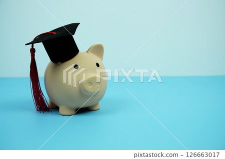 Piggy bank with graduate black cap Education and financial concept 126663017