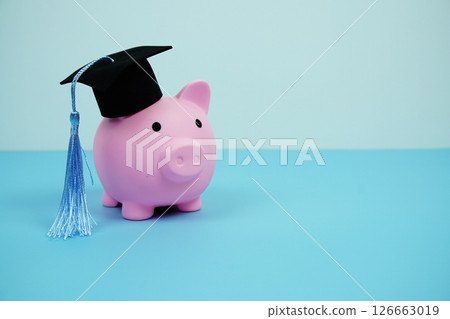 Piggy bank with graduate black cap Education and financial concept 126663019