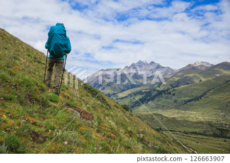 Woman backpacker hiking on high altitude mountains top 126663907