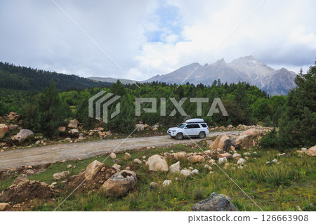 Sichuan,China - September 09,2024 ,Driving Toyota off road car on the high altitude mountains Sichuan,China - September 09,2024 ,Driving Toyota off road car on the high altitude mountains 126663908