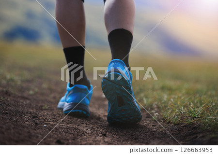 Fitness woman runner running at high altitude grassland mountain top road Fitness woman runner running at high altitude grassland mountain top road 126663953
