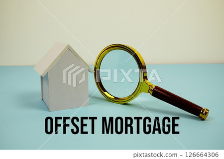 Offset Mortgage text with White Model House and magnifying glass on blue background Offset Mortgage text with White Model House and magnifying glass on blue background 126664306