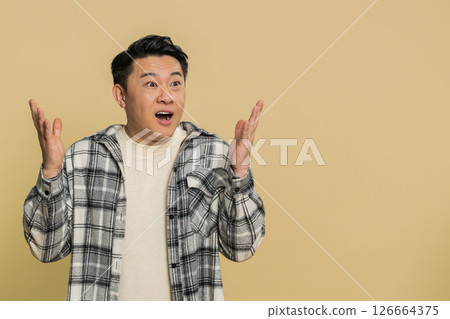 Excited amazed man surprise looking at camera with big eyes shocked by sudden victory wow emotion Excited amazed man surprise looking at camera with big eyes shocked by sudden victory wow emotion 126664375