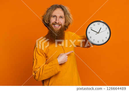 Excited Caucasian man showing time hour on wall office clock ok thumb up approve hurry up deadline 126664489