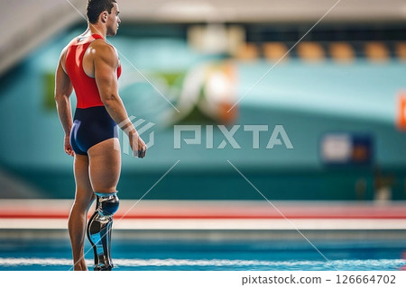Determined swimmer with prosthetic leg trains for competition in clear blue water showcasing strength and resilience Determined swimmer with prosthetic leg trains for competition in clear blue water showcasing strength and resilience 126664702