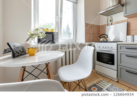 Cozy Kitchen Dining Nook with Modern Appliances 126664934