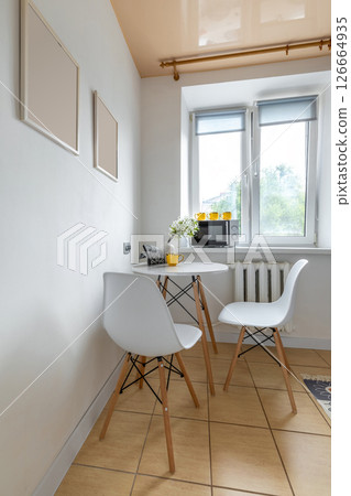 Bright Corner Kitchen Table with Flower Vase 126664935