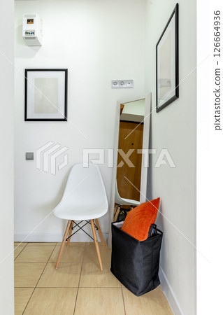 Minimalist Hallway Corner with Chair and Mirror 126664936