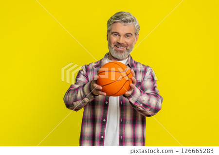 Mature man spinning basketball, playful dribble exchange, sporty game skill display energetic vibe Mature man spinning basketball, playful dribble exchange, sporty game skill display energetic vibe 126665283