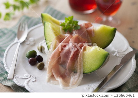 Earl's melon topped with prosciutto Earl's melon topped with prosciutto 126666461