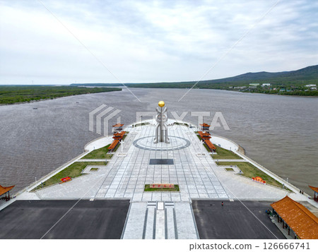 FUYUAN, CHINA - MAY 13 2025- Aerial view of Eastern Square. The monument of Fuyuan city is the most eastern point of China, border crossing between China and Russia. FUYUAN, CHINA - MAY 13 2025- Aerial view of Eastern Square. The monument of Fuyuan city is the most eastern point of China, border crossing between China and Russia. 126666741