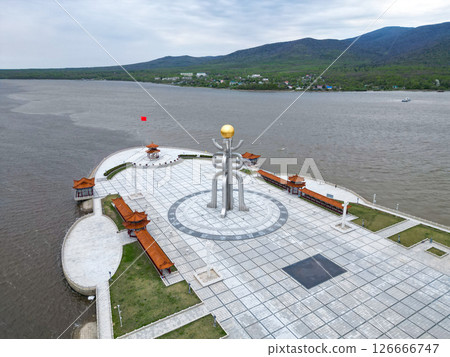 FUYUAN, CHINA - MAY 13 2025- Aerial view of Eastern Square. The monument of Fuyuan city is the most eastern point of China, border crossing between China and Russia. FUYUAN, CHINA - MAY 13 2025- Aerial view of Eastern Square. The monument of Fuyuan city is the most eastern point of China, border crossing between China and Russia. 126666747