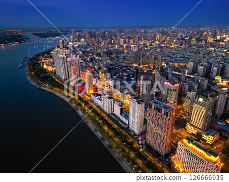 Harbin, CHINA-MAY 05, 2025-Aerial cityscape of Harbin's downtown, is the capital of Heilongjiang, China. It is the largest city of Heilongjiang 126666935