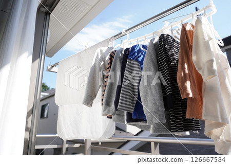 Laundry hung out on the balcony/hanging out to dry Laundry hung out on the balcony/hanging out to dry 126667584